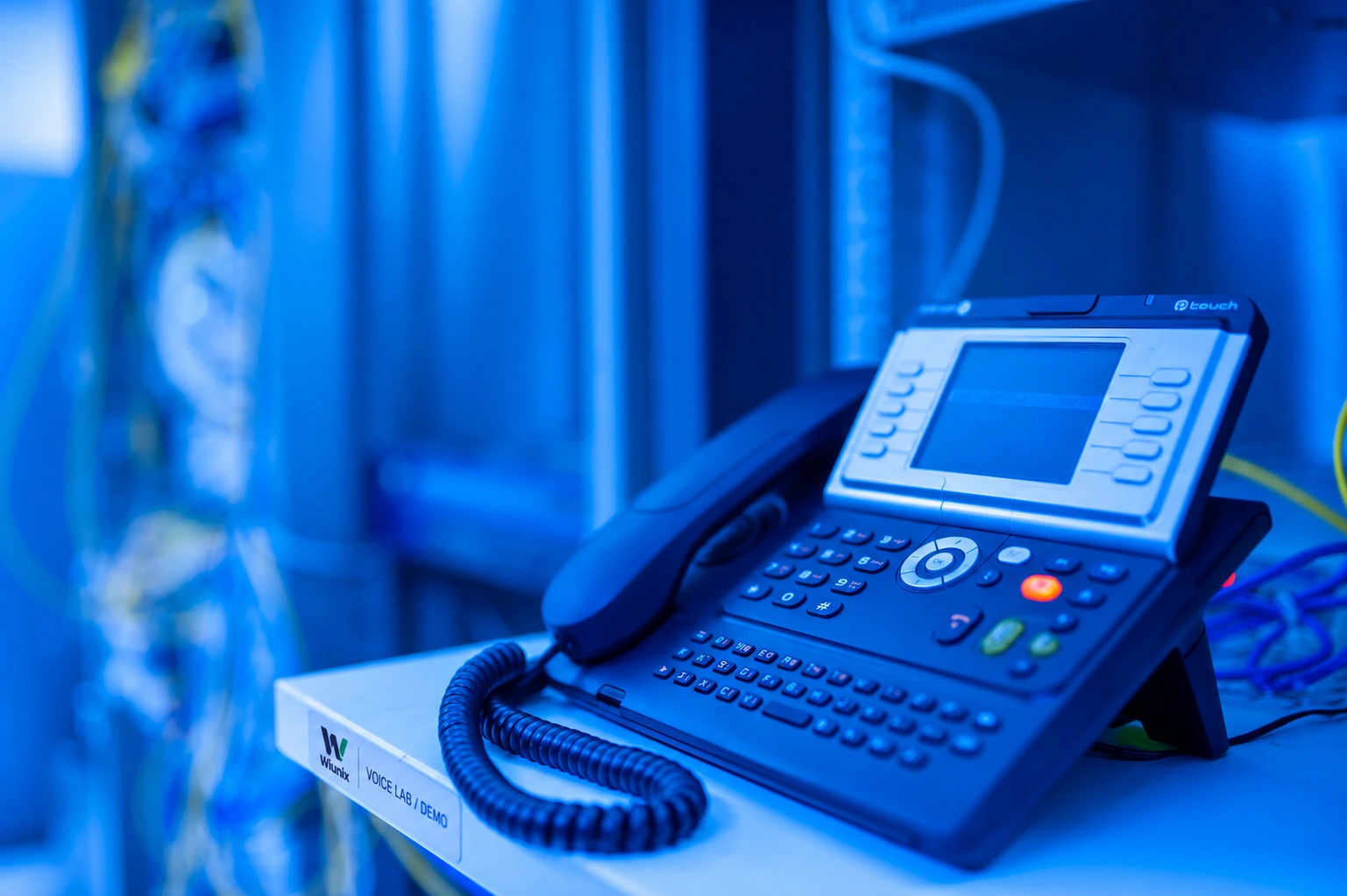 IP phone and equipment with an illustrative Wiunix voice-lab label